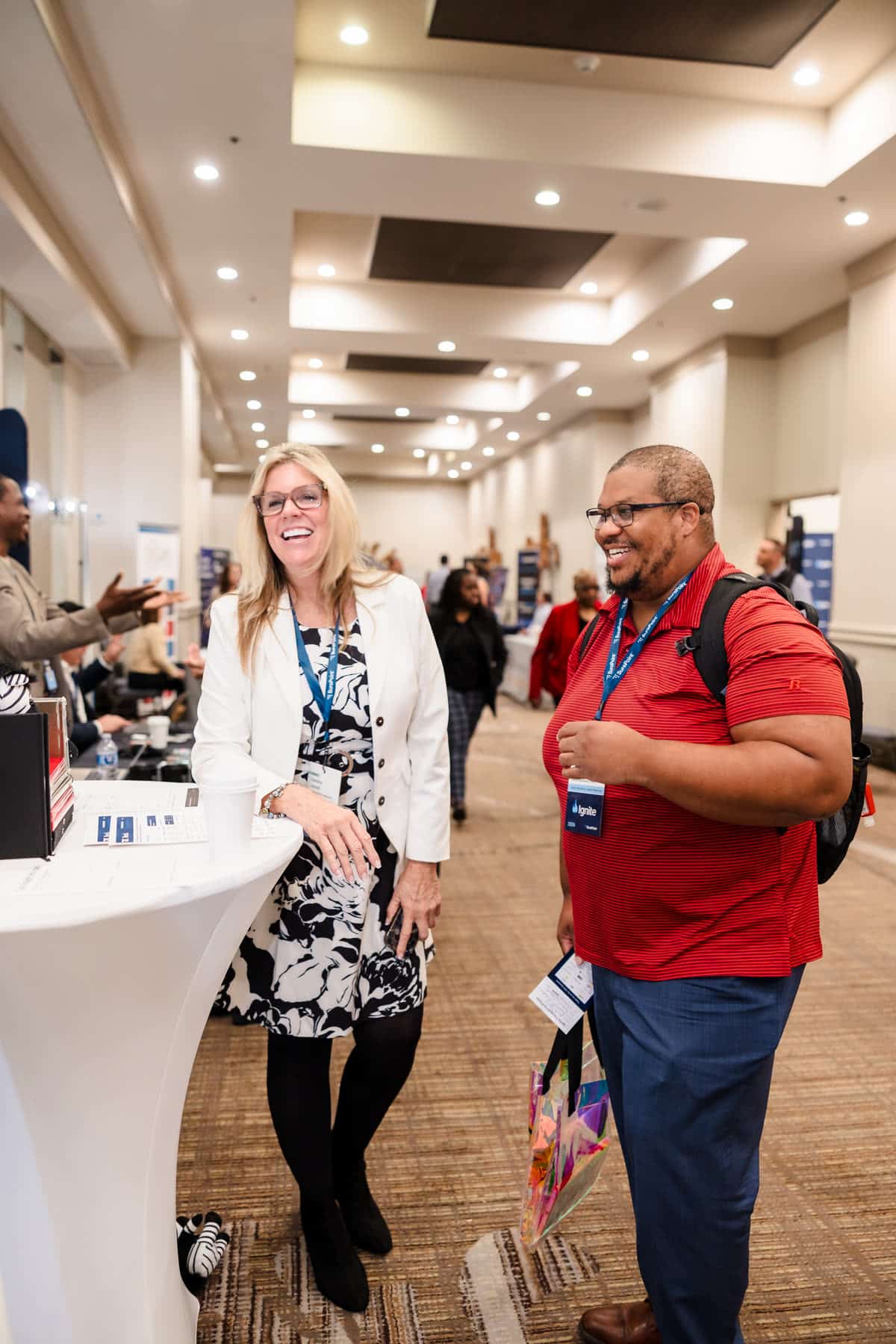 Two attendees chatting at Ignite 2026