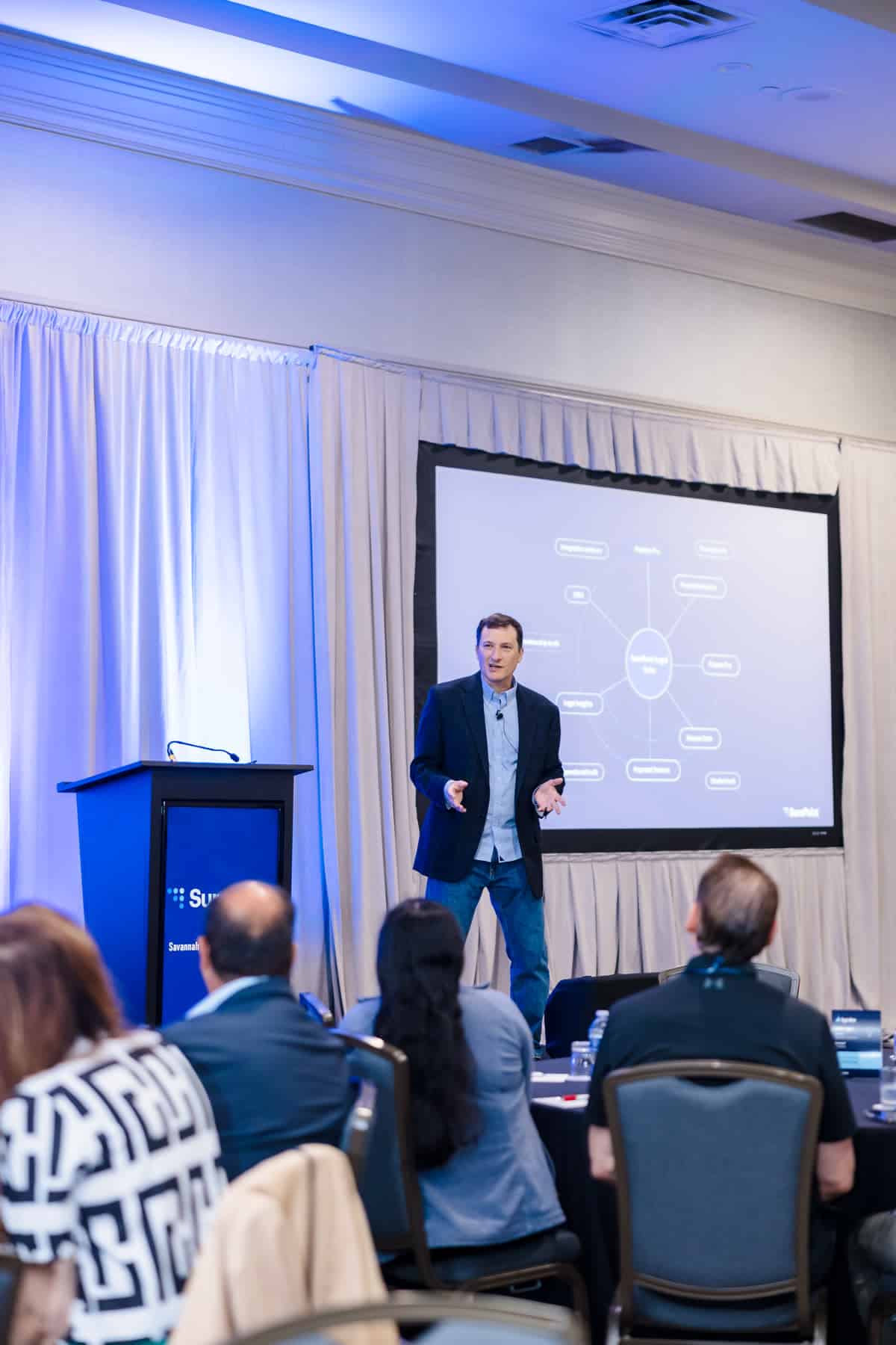 Speaker presenting on stage at Ignite 2026